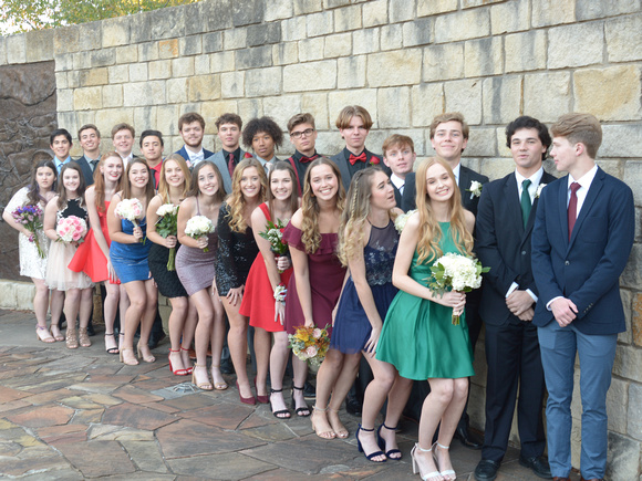 Luke, in red bow tie, surrounded by friends going to homecoming.